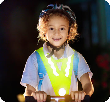 Vêtements réfléchissants Siser et trottinette pour enfant